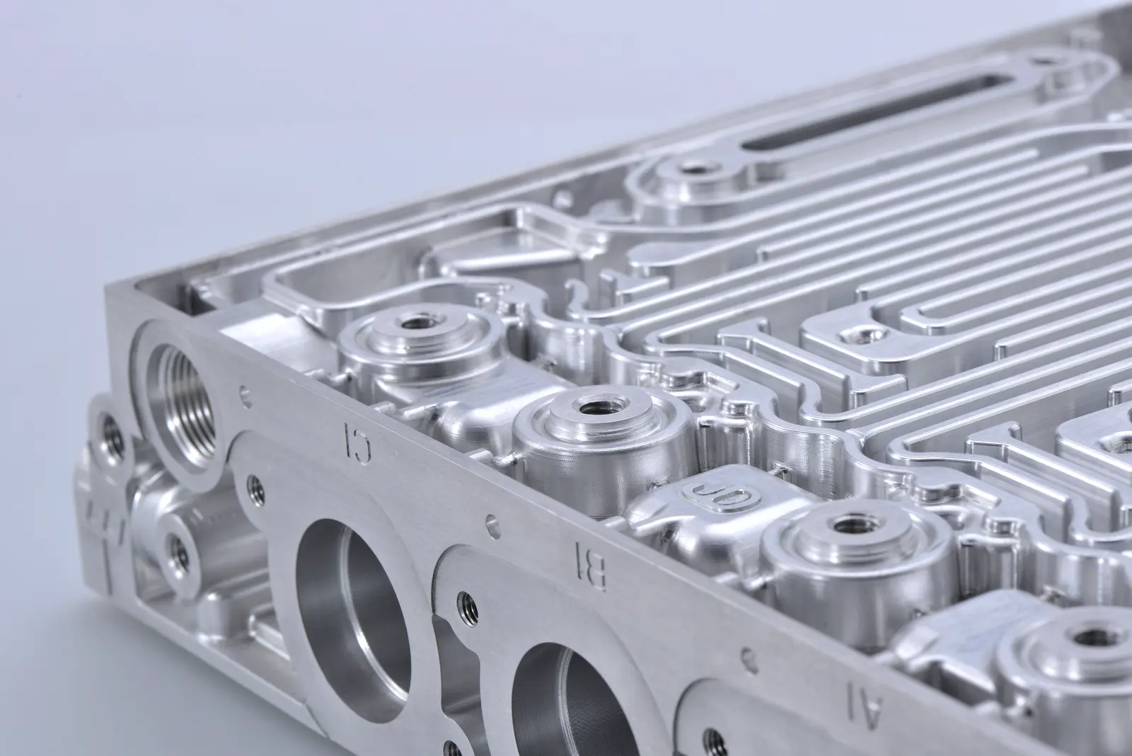 Machined aluminium plate with precise pockets and threaded holes